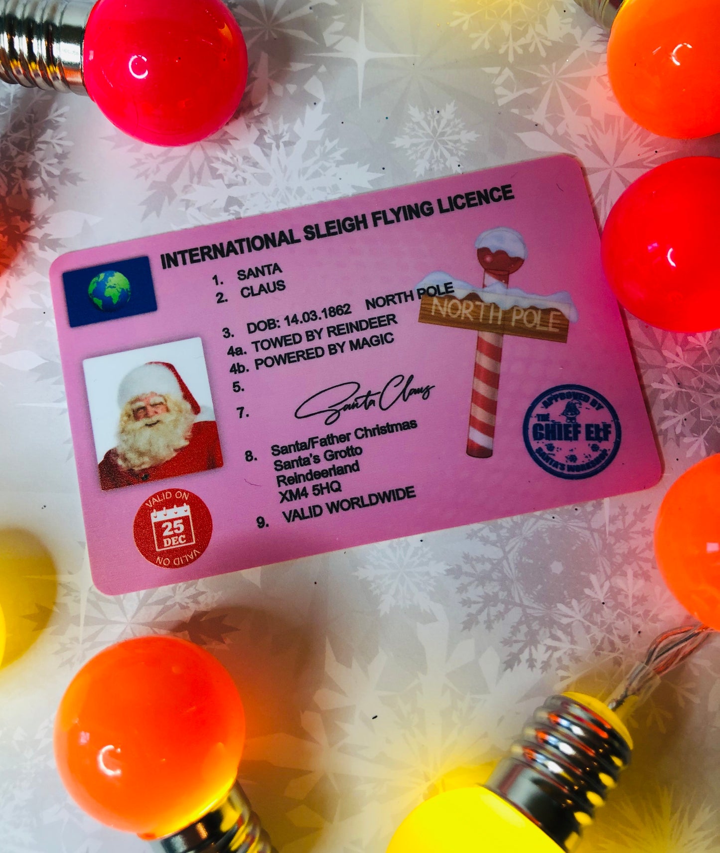 a pink Santa driving license featuring his face and north pole logo from Lilybet Loves